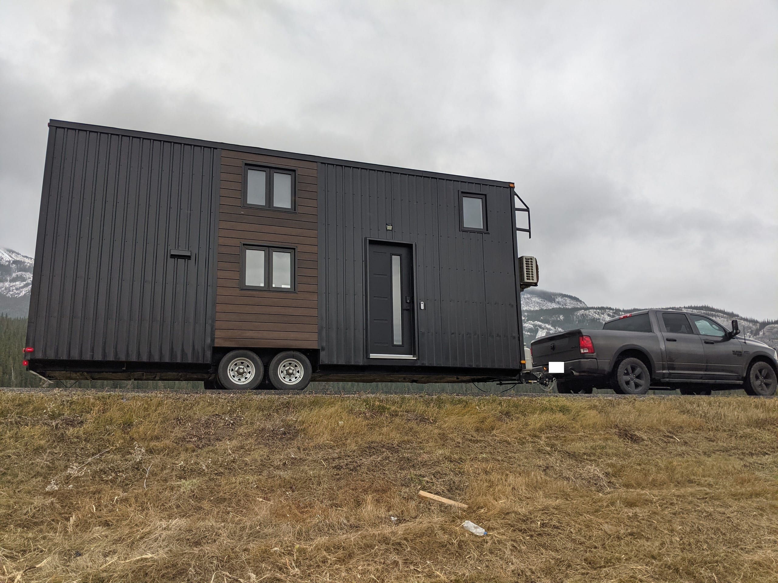 Historical 2021 photograph of the tiny house on its trailer during transport